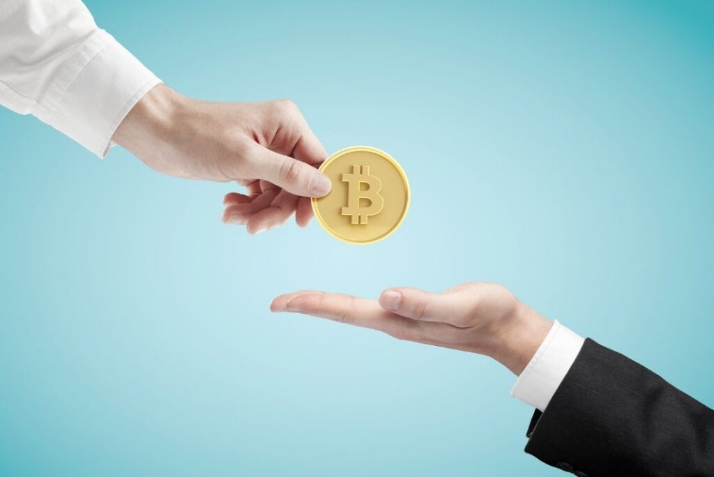 Illustration of someone handing Bitcoin over